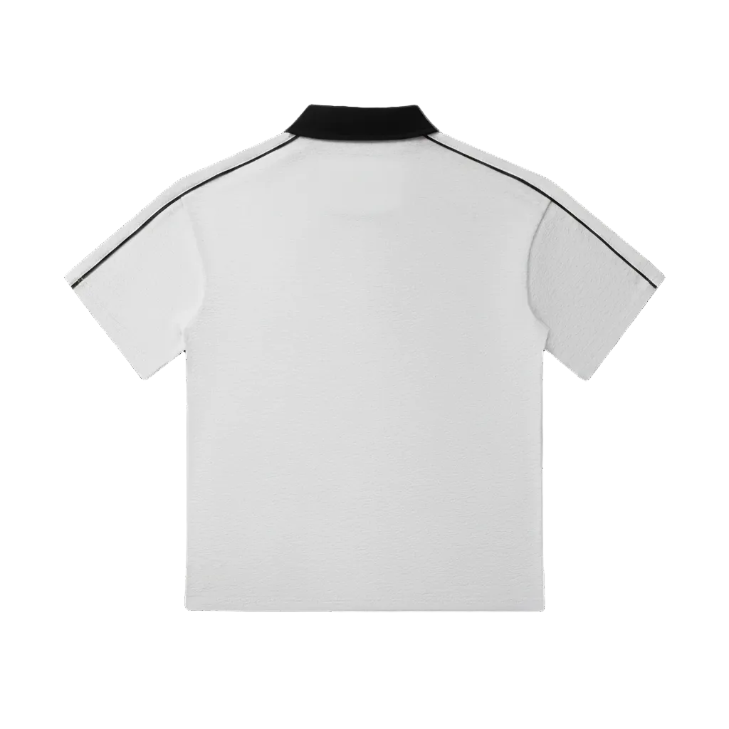 White polo shirt with black collar and trim, short sleeve design