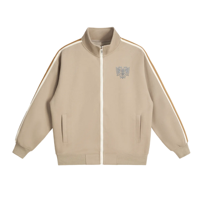 Beige zip-up jacket with eagle emblem and striped sleeves