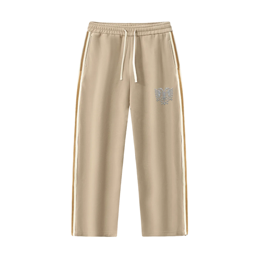 Beige drawstring joggers with side stripes and eagle emblem, relaxed fit athletic pants
