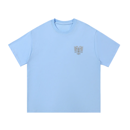 Light blue t-shirt with embroidered eagle design on chest, casual streetwear style