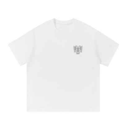 White t-shirt with embroidered eagle logo on chest, minimalist streetwear design