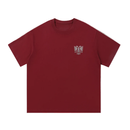 Burgundy T-shirt with embroidered eagle skeleton design on chest, bold streetwear style
