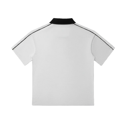 White polo shirt with black collar and trim, short sleeve design