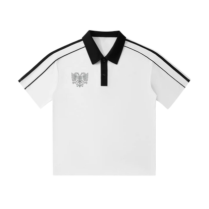 White polo shirt with black collar, striped sleeves, and eagle emblem, stylish men's fashion