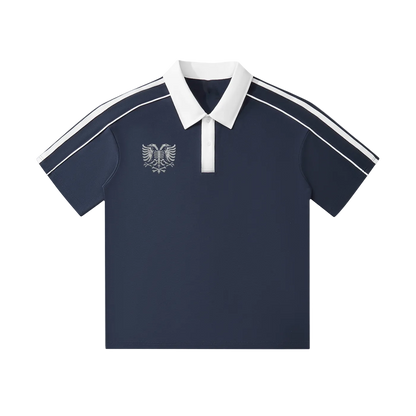 Navy polo shirt with white collar, sleeve stripes, and eagle emblem, ideal for casual or sporty wear.