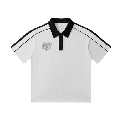 White polo shirt with black collar, sleeve stripes, and eagle emblem, stylish men's casual wear